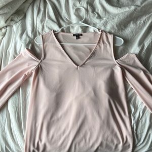 Express long sleeve pink, open-shoulder shirt.